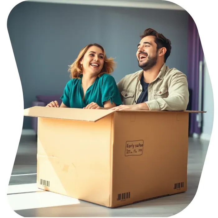 Two guys sitting on the floor of their apartment with Muval moving boxes